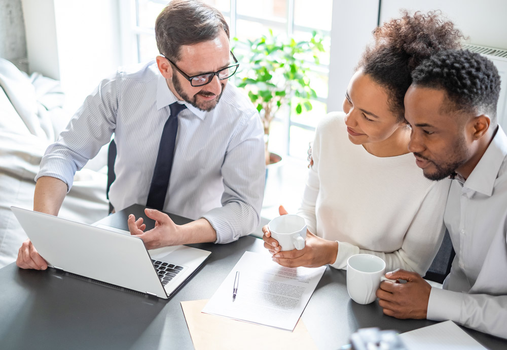 young couple working with an estate planning attorney